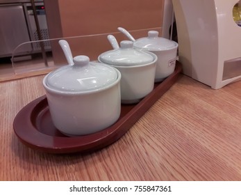 Containers for condiments on the table.