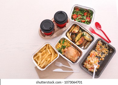 Containers With Tasty Takeout Meals On Light Background, Top View. Food Delivery