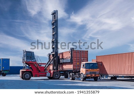 Containers warehouse storage at shipyard loading distribution goods by forklift truck transport delivery export commerce global business.