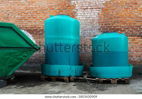 containers with waste engine oil and cooling\
fluid collected at car service for\
disposal