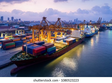 Containers yard in port congestion with ship vessels are loading and discharging operations of the transportation in international port.Shot from drone. - Shutterstock ID 1080523223