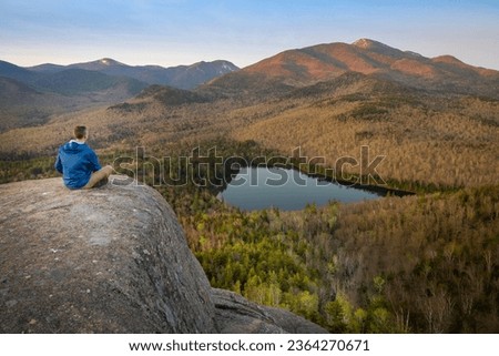 contemplating the Adirondack Mountains near Lake Placid