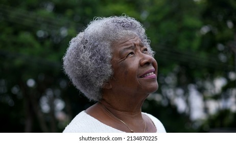 A Contemplative Black Senior Woman Closing Eyes In Meditation