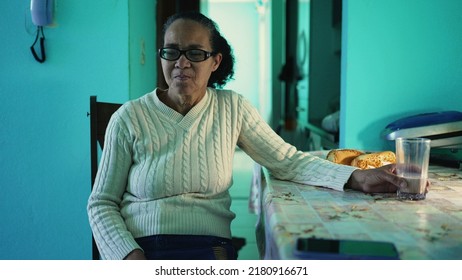 A Contemplative Senior Lady Sitting At Home Alone. A Thinking Older Casual Woman