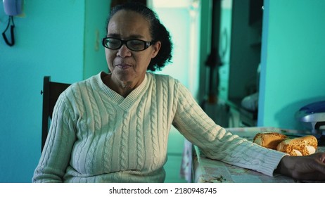 A Contemplative Senior Lady Sitting At Home Alone. A Thinking Older Casual Woman