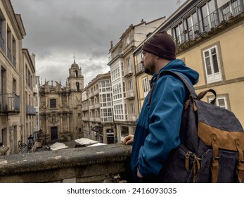 Contemplative Solo Traveler Overlooking Historic Cityscape - Powered by Shutterstock