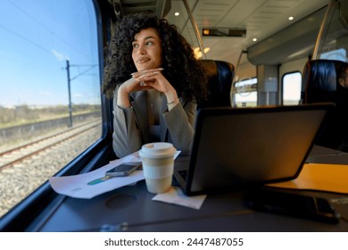 Contemplative woman enjoying the solitude of her train journey, looking out the window with a wistful expression. - Powered by Shutterstock