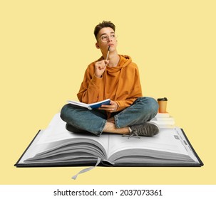 Contemporary art collage of male student sitting on notebook and thinking, making notes. Importance of education. Support online schools. Concept of online study, education, ad