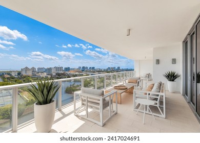 Contemporary Balcony Photoshoot located in Florida, USA. Showcasing modern architectural design and development. Beautiful clear Skyline, commercial area view with canals and beach. - Powered by Shutterstock