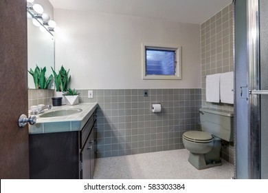 Contemporary Bathroom Features Soft Gray Walls On Top Half Of Walls And Gray Subway Tiles Cover Bottom Half Of Wall. Northwest, USA
