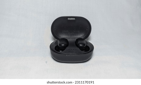 Contemporary black wireless headset or Earbuds that is ready to use - Shutterstock ID 2311170191