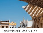 Contemporary city architecture of Metropol Parasol or Las Setas - large structure located at La Encarnacion square in old quarter of Seville, Spain. 