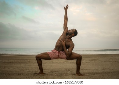 Contemporary Dance Choreographer And Dancer Doing Ballet Beach Workout - Young Attractive And Athletic Black African American Man Dancing Outdoors Doing Beautiful Dramatic Performance 