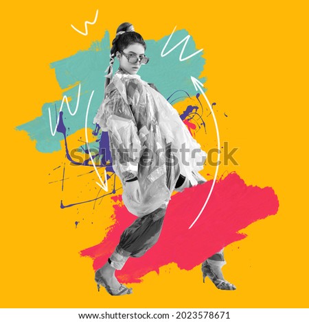 Contemporary design. Young beautiful female fashion model in clothes made of plastic bags over orange background with paint strokes. Concept of design, fashion, vintage style