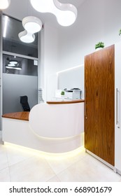 Contemporary Designed Front Desk With Supplies At Dental Office