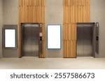 Contemporary elevator lobby featuring two modern elevators with polished metal doors on corridor lobby, mockup billboard with frame between elevators, blank space for advertisement or announcement