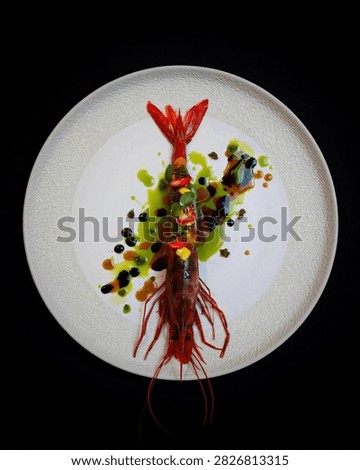 Contemporary fine dining presentation featuring lobster arranged with colorful vegetables, delicate herbs and artistic sauce accents on a clean white plate. The elegant composition highlights modern culinary creativity, premium ingredients and professional plating, making this image ideal for luxury restaurant advertising, chef portfolios, menu design, gastronomy magazines and hospitality campaigns. Vibrant colors and refined details communicate exclusivity, craftsmanship and upscale dining.