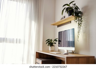 A Contemporary Home Office With High Tech Computer On Desk.