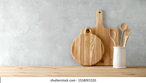 Contemporary kitchen background with kitchen utensils standing on wooden countertop,  blank space for a text, front view - Shutterstock ID 1518091520