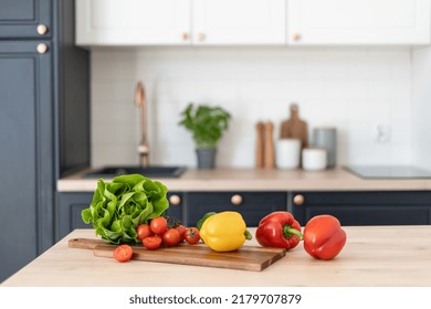 Contemporary kitchen interior design. Healthy food products on table. Salad ingredients. Cooking at home. Home comfort. Healthy nutrition and lifestyle - Powered by Shutterstock