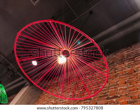 Contemporary loft style ceiling lamp. Interior decorating concept. Selective focus.