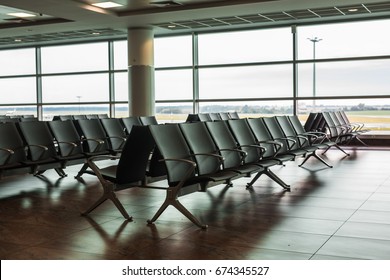 contemporary lounge with seats in the airport - Shutterstock ID 674345527