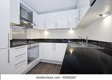 Contemporary Luxury Kitchen In White With Black Stone Worktop