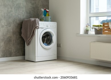 Contemporary Luxury Laundry In A Brand New Apartment In White.