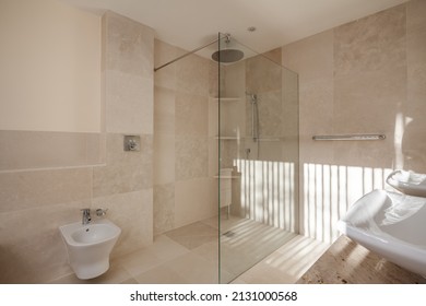 Contemporary modern sunlit tiled shower room with walk in shower cubicle - Shutterstock ID 2131000568