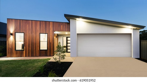 Contemporary new Australian home lighting at dusk - Shutterstock ID 619051952