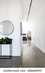 Contemporary New Home Entry And Hallway With Polished Concrete Floors