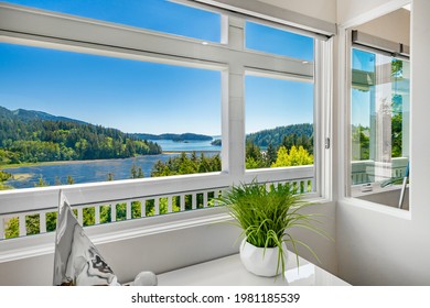 Contemporary Pacific Northwest Home With Blue Sky And Water Views Bright White Interior