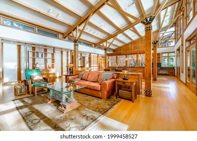 Contemporary Pacific Northwest home living room and dining room with high vaulted ceilings wood beams - Powered by Shutterstock