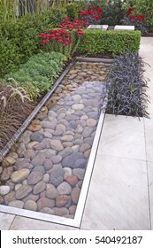 The Contemporary Patio Area And Water Feature In A Relax And Reflective Garden