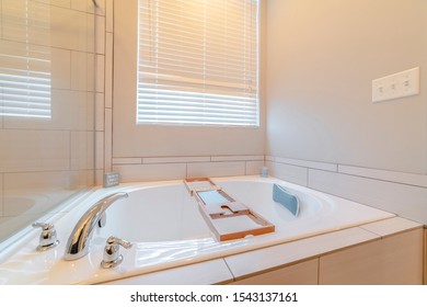 Contemporary Spa Bath With Wooden Tray Caddy