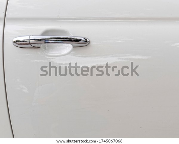 contemporary white car door and chrome handle, space\
for your text