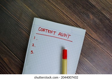 Content Audit Write On A Book With Keywords Isolated On Wooden Table.