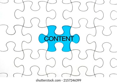 Content Concept, Content Word On White Puzzle Piece On Blue Background.  