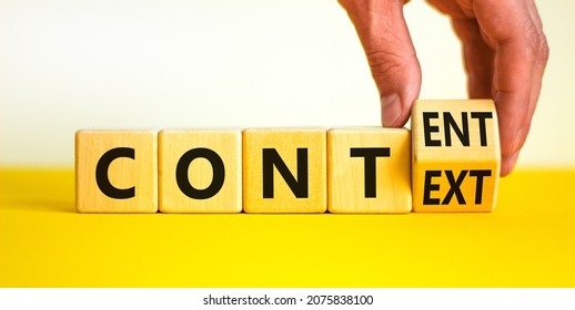 Content and context symbol. Businessman turns a wooden cube and changes the word context to content. Beautiful yellow table, white background. Business and content and context concept. Copy space.