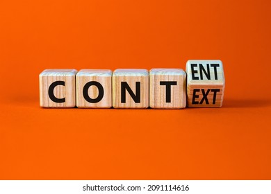 Content and context symbol. Turned a wooden cube and changed the word context to content. Beautiful orange table, orange background. Business and content and context concept. Copy space. - Shutterstock ID 2091114616