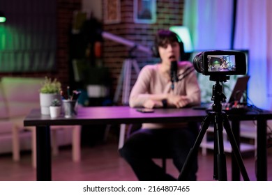 Content Creator Vlogging Lifestyle Podcast Episode On Camera, Using Live Broadcasting Equipment In Studio. Female Vlogger Recording Online Talk Show Conversation, Web Livestream.