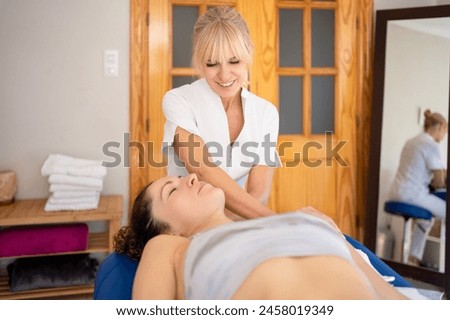 Image, Stock Photo Content female physiotherapist treating neck of patient