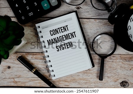Content Management System (CMS) text on notepad, Business and Financial concept background