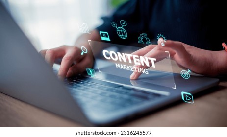 Content marketing concept with a woman working on a laptop on a futuristic virtual interface screen. - Shutterstock ID 2316245577