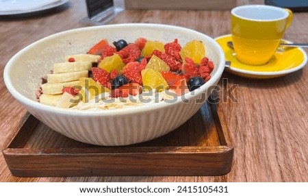 Content related to healthy breakfast with fruits and nuts, serve with tea. It can be used to present food, food related, cooking, eating, drinking.