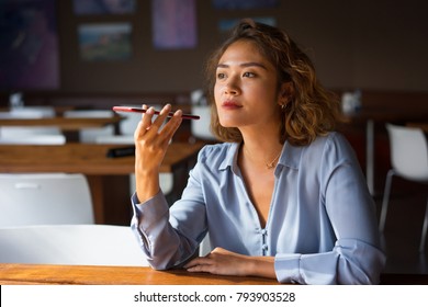 Content Woman Talking On Phone With Loudspeaker