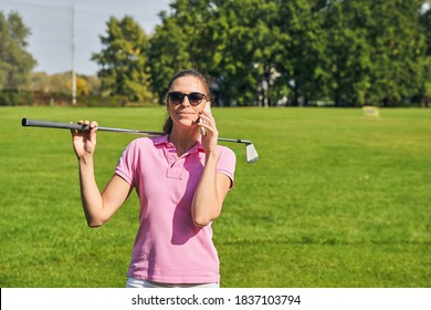 Contented Dark-haired Caucasian Lady Golfer In Sunglasses Making A Phone Call On The Driving Range