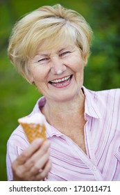  Contentment. Jubilant Ecstatic Old Woman Holding Ice-Cream And Laughing