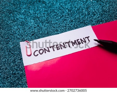 Contentment writting on table background.