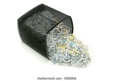 Contents Of A Paper Shredder Emptied On A White Background.